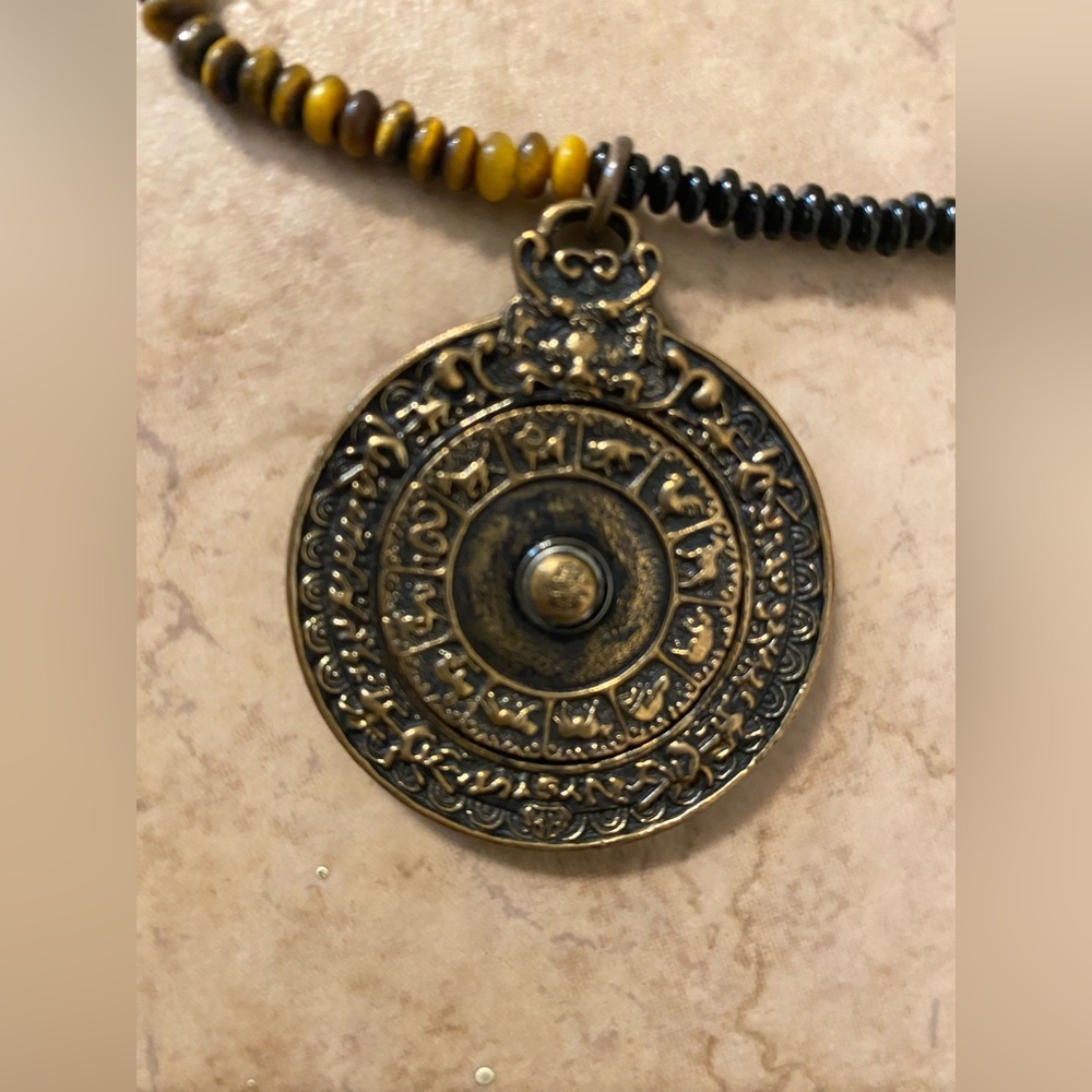 Karma and Luck necklace with 18inch chain.  Center circle moves!